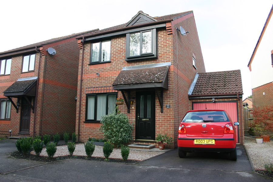 Traditional Red Brick House With Black Windows