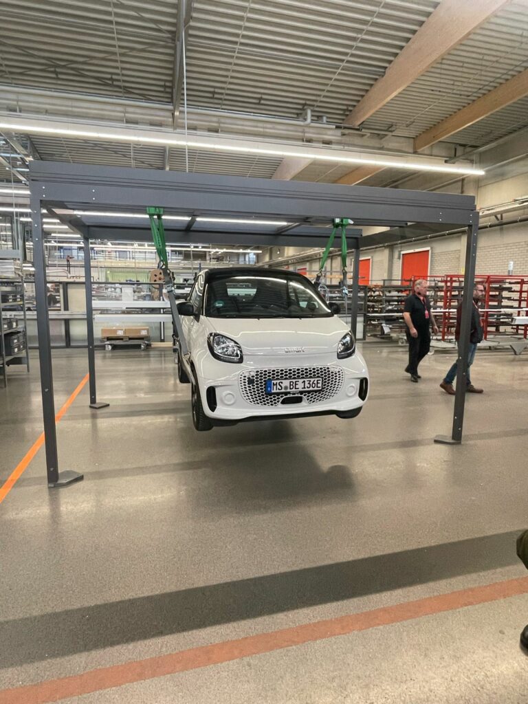 Solarlux proved the strength of their Wintergarden structures by hanging an all-electric Smart Car that weighs over a tonne from one! 