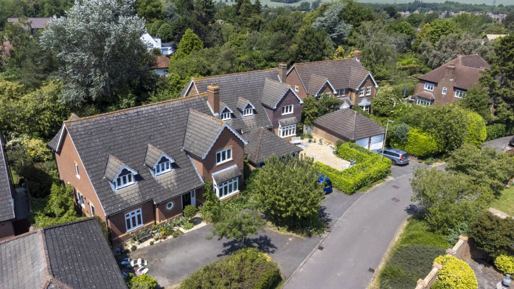 A Residential Street of Detached Oxford Houses features TVW Double Glazed Windows and Doors.