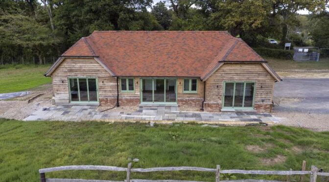 Bespoke Pale Green Windows for a Luxury Oak-Framed Home in Surrey