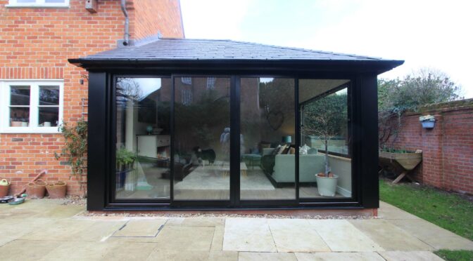 Black Warm Roof Conservatory with Slimline Sliding Doors, Oxford