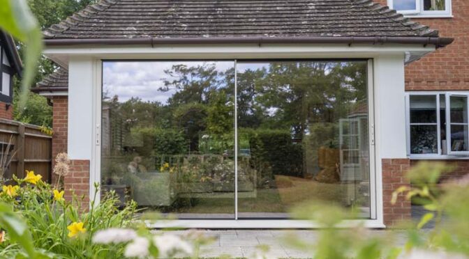 Cream Sliding Door for an Open-Plan Kitchen in Shurlock Row