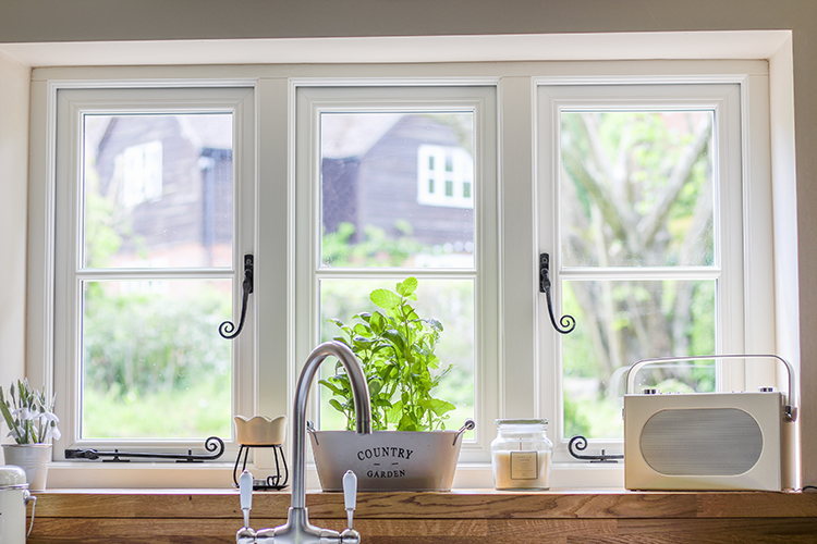 Kitchen window with black handles