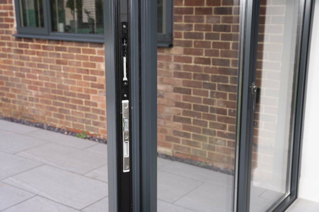 Close-up of bifold door lock points and security hardware