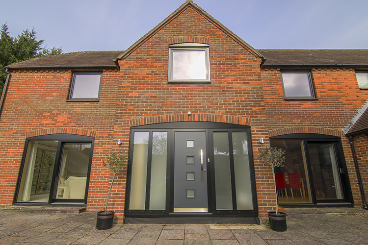 Traditional Red Brick House With Black Windows