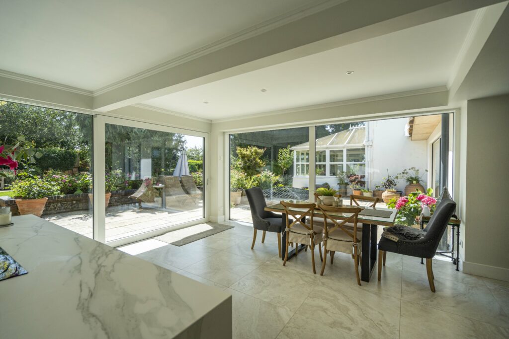 Large aluminium sliding patio doors with uninterrupted garden views