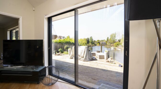 Minimal Framed Sliding Doors for Riverside property, Weybridge