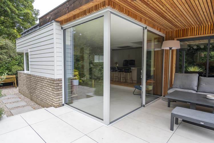 Contemporary open plan living room featuring external sliding patio doors.