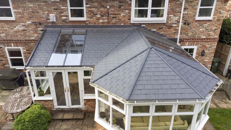 P-shaped conservatory design combining Victorian and lean to styles for extra living space