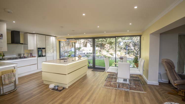 Large aluminium sliding patio doors with uninterrupted garden views