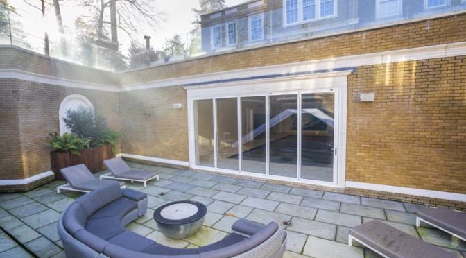 Slim White Bifold Doors for Luxurious Basement Swimming Pool, Virginia Water