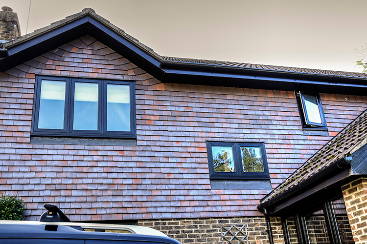 Traditional Red Brick House With Black Windows