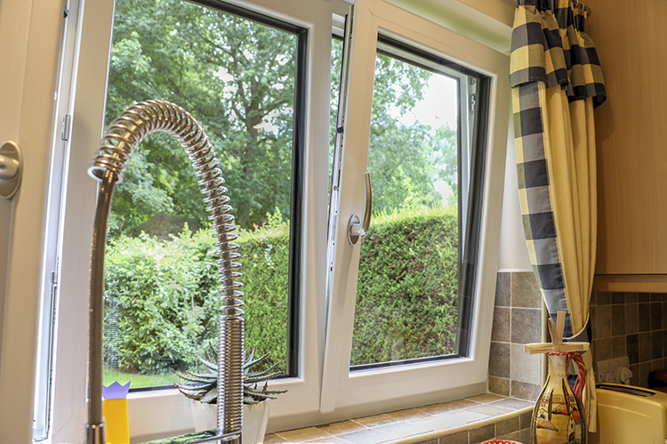 White aluminium tilt and turn windows in contemporary kitchen