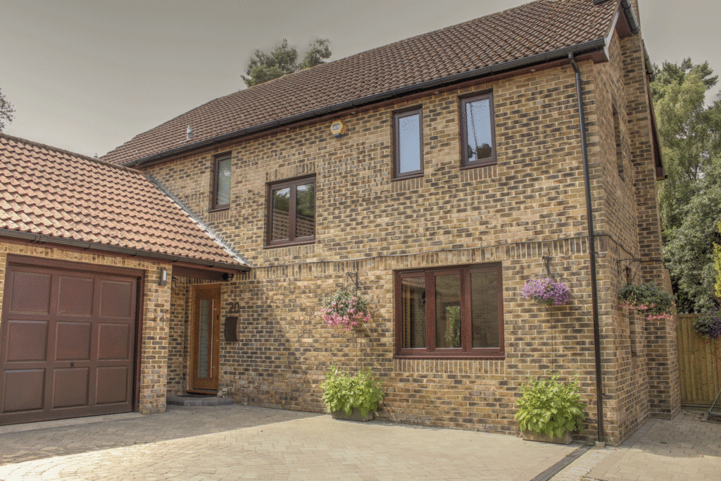 Pirnar Oak colour front door and Rosewood uPVC windows